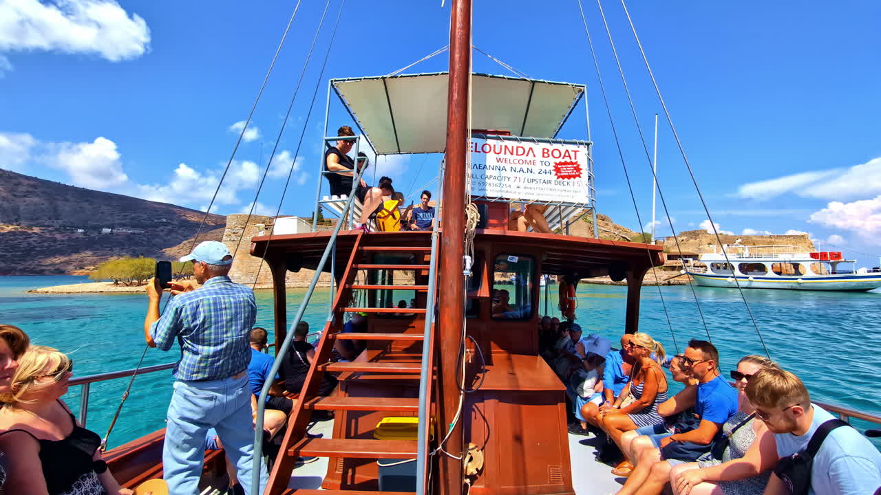 Riding a tourist boat in the Gulf of Elounda, north-eastern Crete, Greece near Spinalonga Island