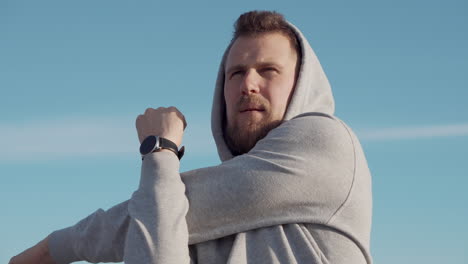 man stretching outdoors