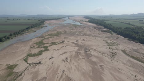 sandy river bottom of burdekin river during drought season in queensland, australia