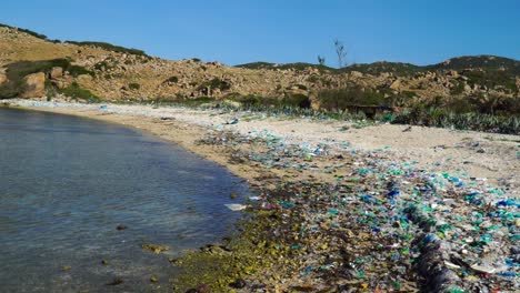 beach and sea contaminated by plastic trash , vietnam coast pollution