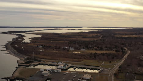 an-aerial-view-over-the-eastern-end-of-Orient-Point,-Long-Island-during-sunset