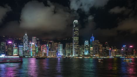 hong kong, china, timelapse view of victoria harbour and hong kong skyline at night