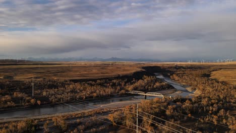 4k aerial footage of a beautiful old truss bridge in rural landscape of alberta, canada