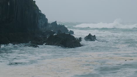 splashing waves at stormy irish coast