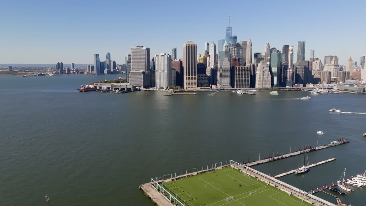 Aerial view approaching Lower Manhattan from Brooklyn, sunny, fall day in NYC