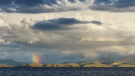 rainbow above mountain lake manasarovar himalayas tibet