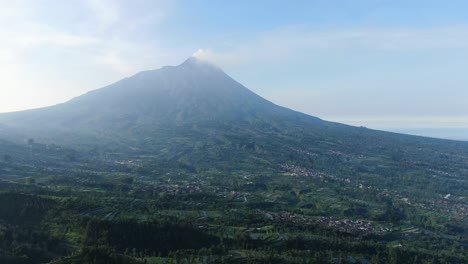 serene landscape of village on slope of mount merapi volcano, indonesia, aerial view