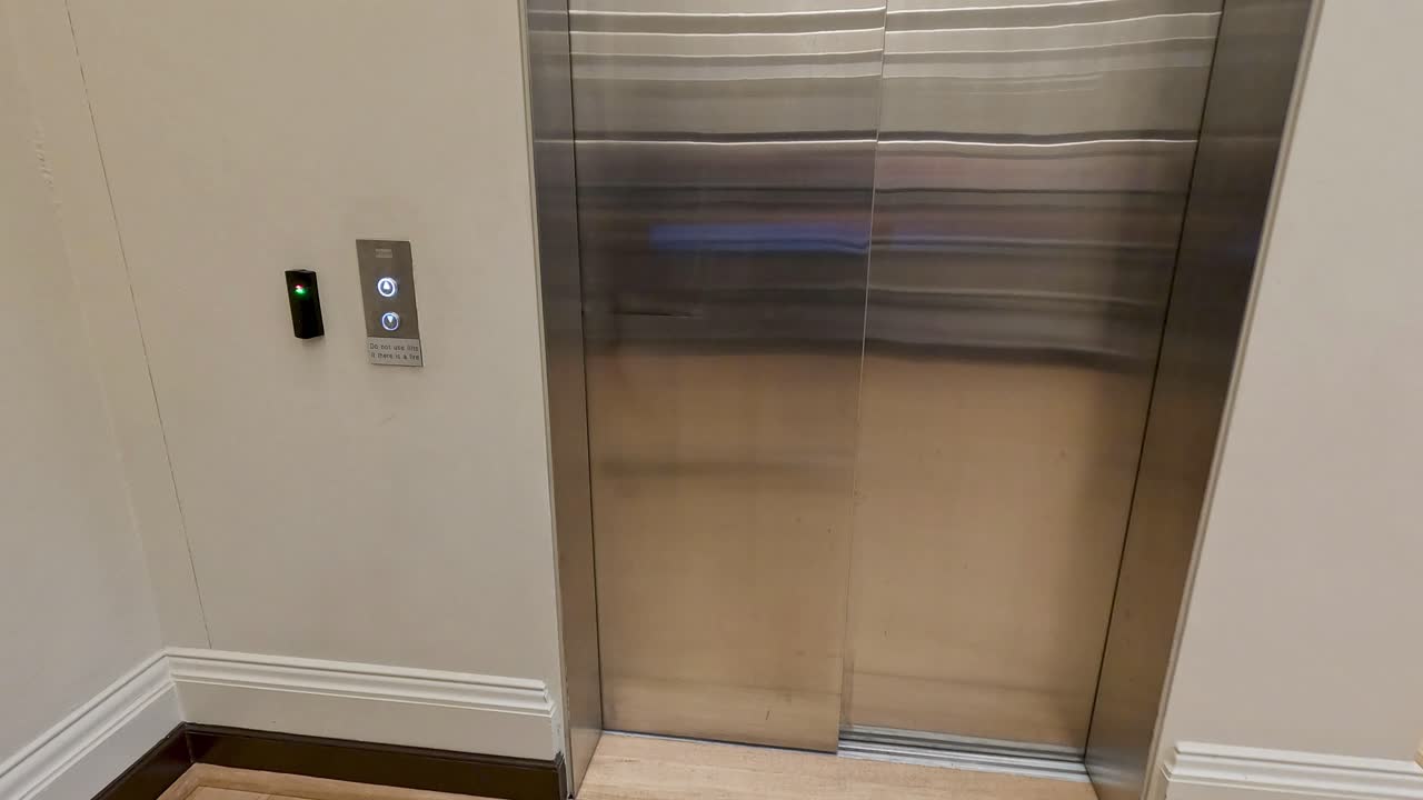 People entering and using an elevator