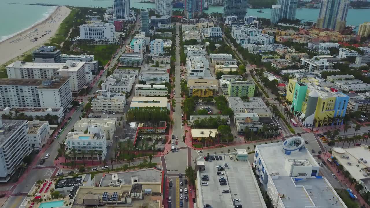 Tilt Up Aerial View of Miami South Beach, Collins Avenue and Hotels and Residental Buildings