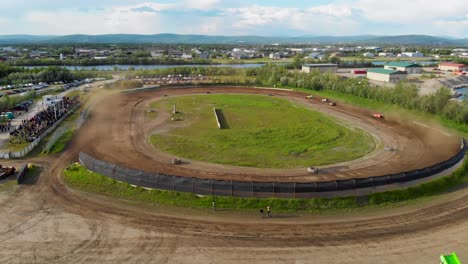 4k drone video of modified stock car racing at mitchell raceway in fairbanks, ak during sunny summer evening-4