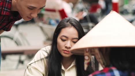 handheld view of vietnamese people at the market