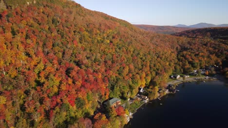 Beautiful-aerial-drone-footage-of-the-fall-leaves-on-and-around-Mount-Hor,-Mount-Pisgah,-and-Lake-Willoughby-during-peak-autumn-foliage-at-Willoughby-State-forest-in-Westmore,-Vermont