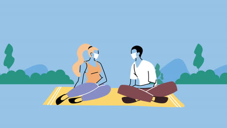 young couple wearing medical masks for covid19 prevention seated in the park