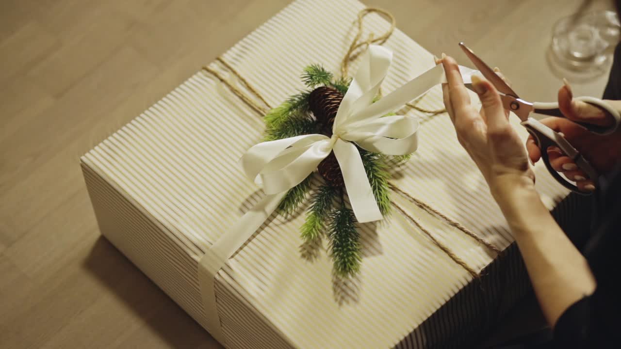 Person Wrapping A Gift With A Natural, Rustic Aesthetic Design. High angle Shot