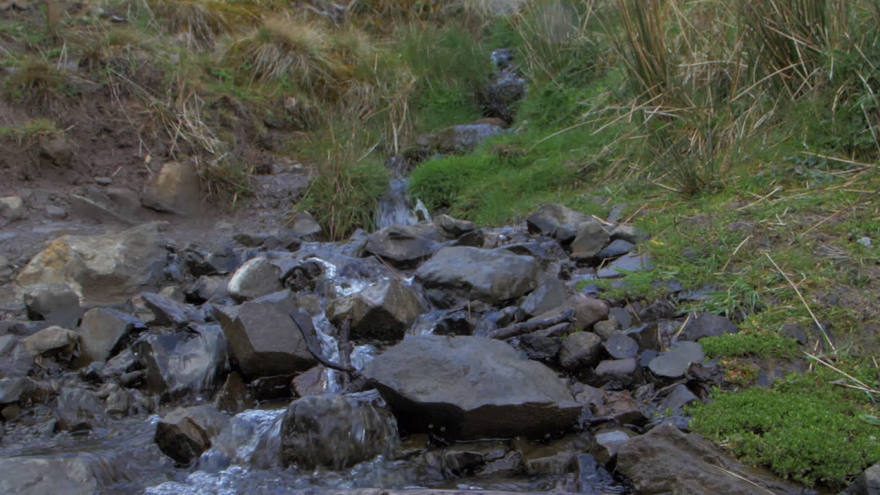 Waterfall in Scotland with a nice view on the Landscape