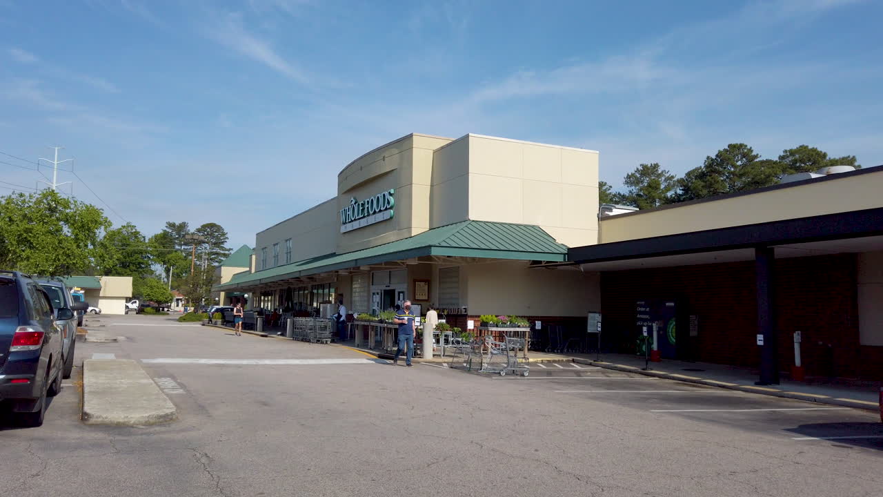 outside whole foods market covid19 social distancing