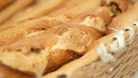 close-up of freshly baked baguettes in a basket