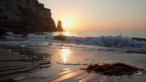 sunrise over rocky coastline and beach