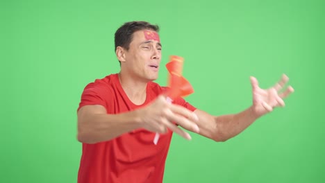nervous man cheering for china during a match looking away