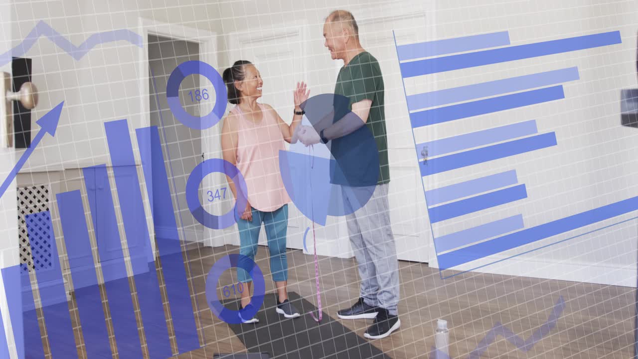 Trainer tapping tablet, starting torso measuring with client on mat, showing blue charts for health