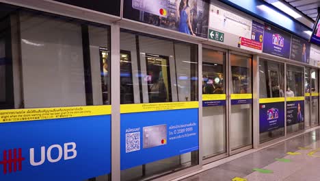 passengers boarding and departing at bangkok station