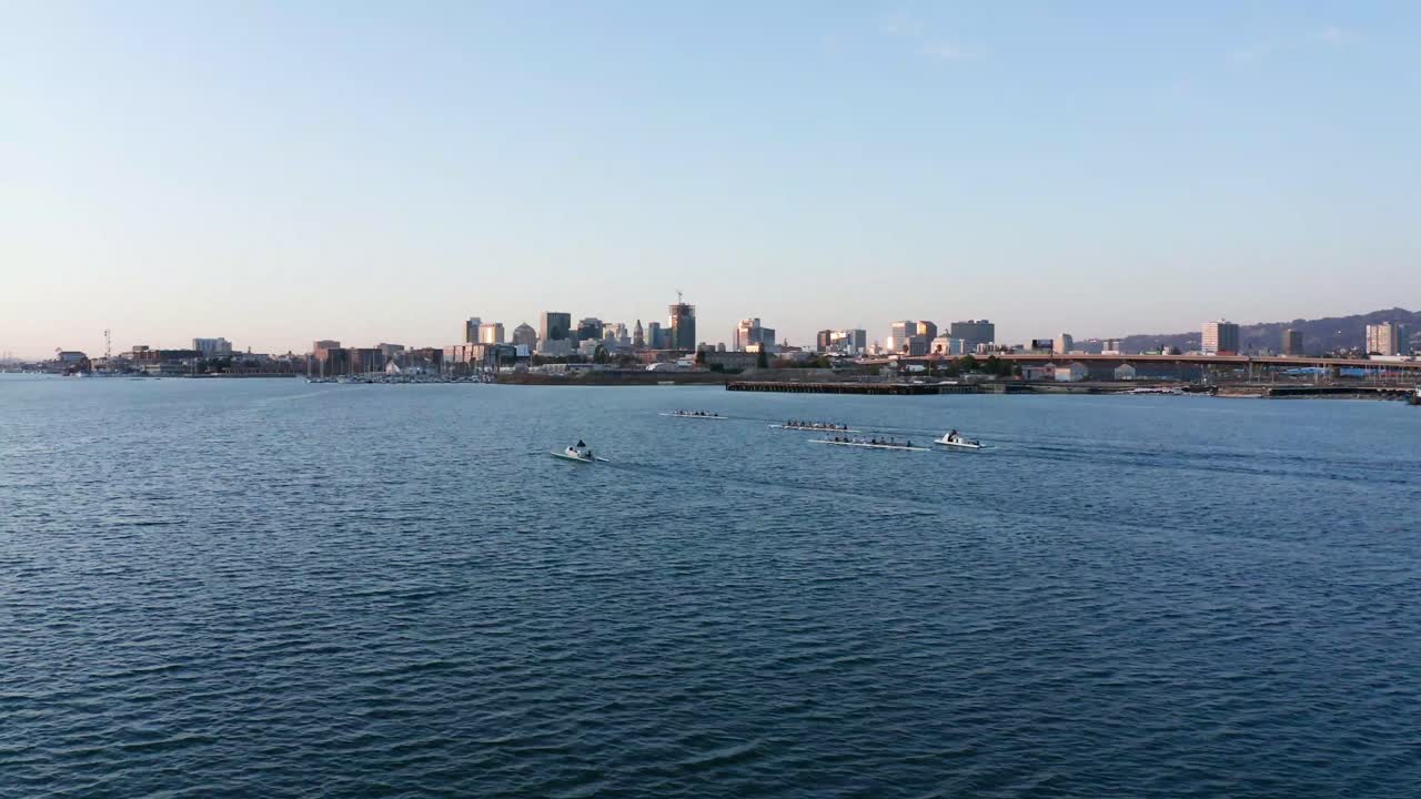 Long shadows and glitter of light across the city and the bay waters