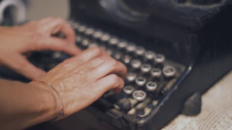 Close-Up-of-Hands-Typing-on-a-Vintage-Typewriter