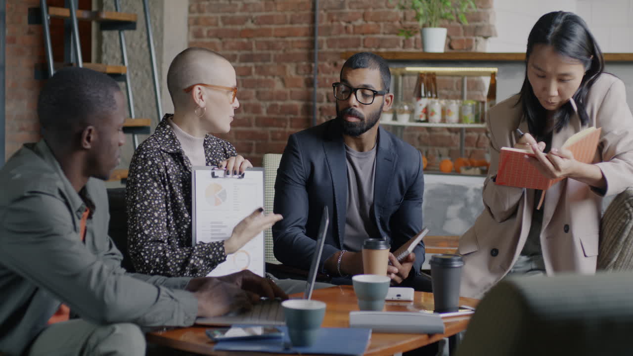 Business Team Meeting in a Cafe
