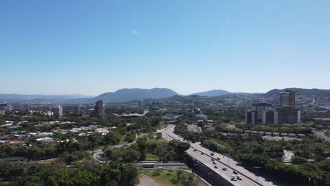 aerial view of a modern city with a busy highway