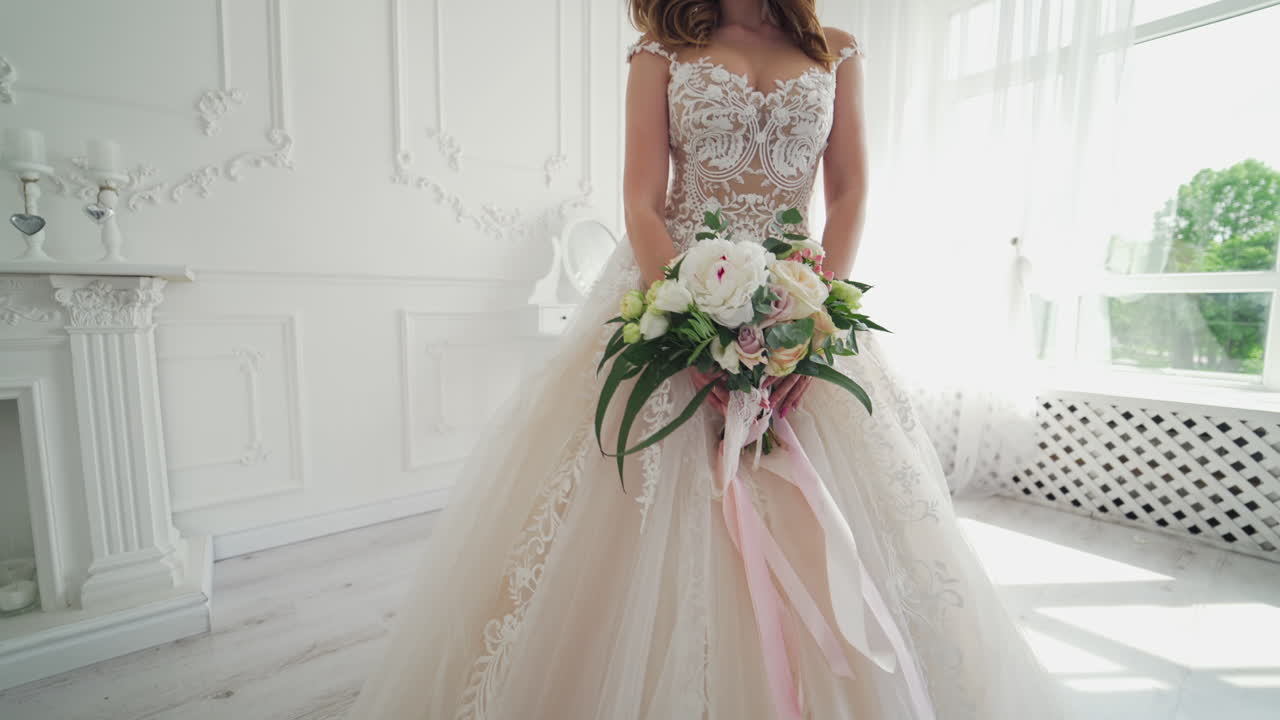 Young attractive bride with flowers. Beautiful bride with a wedding bouquet in studio