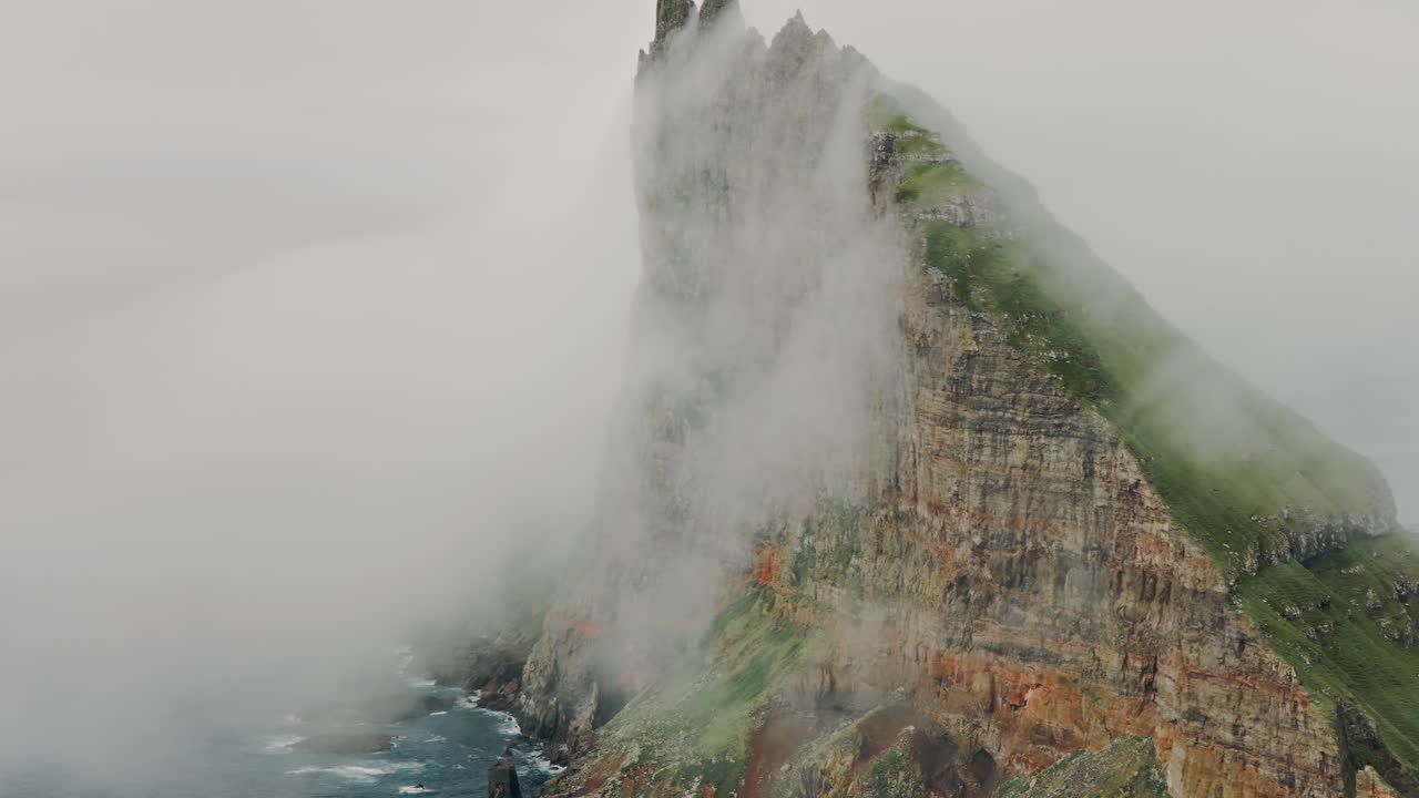Dramatic Cliff Face Shrouded in Fog