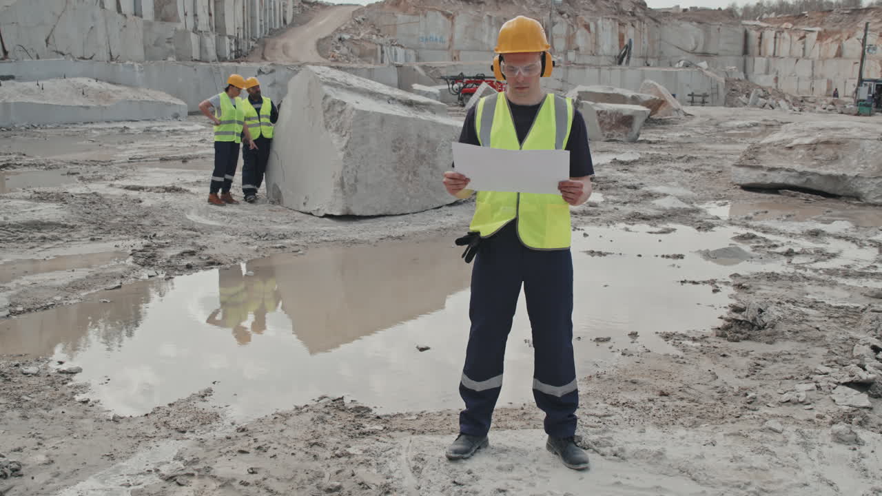 Male Supervisor with Document in Quarry