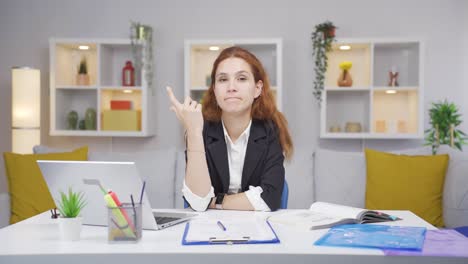home office worker woman thinking looking at camera.