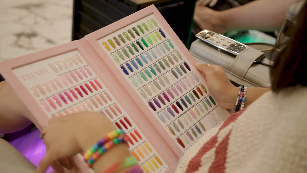 selecting nail color at nail salon