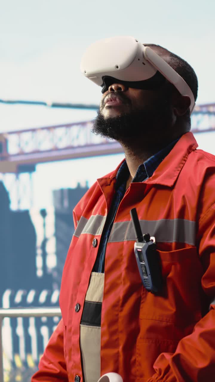 Vertical video Offshore rig worker supervising deck operations using virtual reality simulation