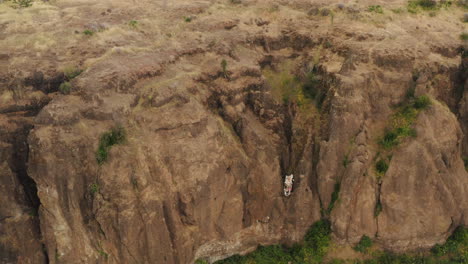 white car stuck in the side of a cliff at butte creek lookout