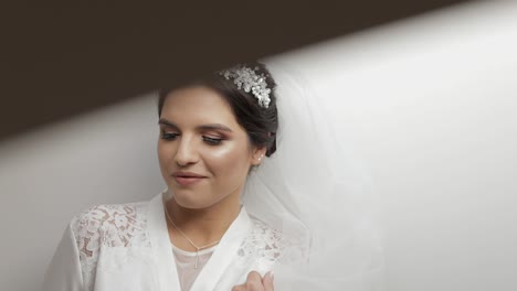 beautiful and lovely bride in night gown and veil. wedding morning. slow motion