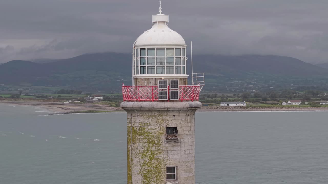Haulbowline Lighthouse by Carlingford Lough, serene coastal view