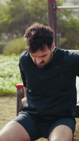 man trains with commitment at the park under the sun