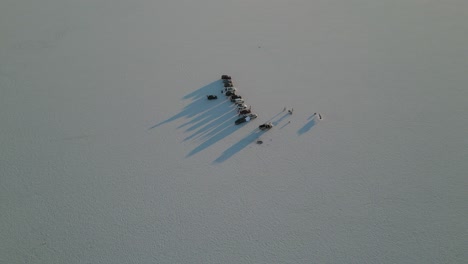 a group of cars at sunset - bonneville salt flats