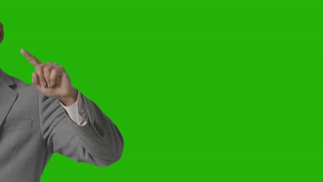 close up on hand of businessman in suit pretending to use ai or vr against green screen 1