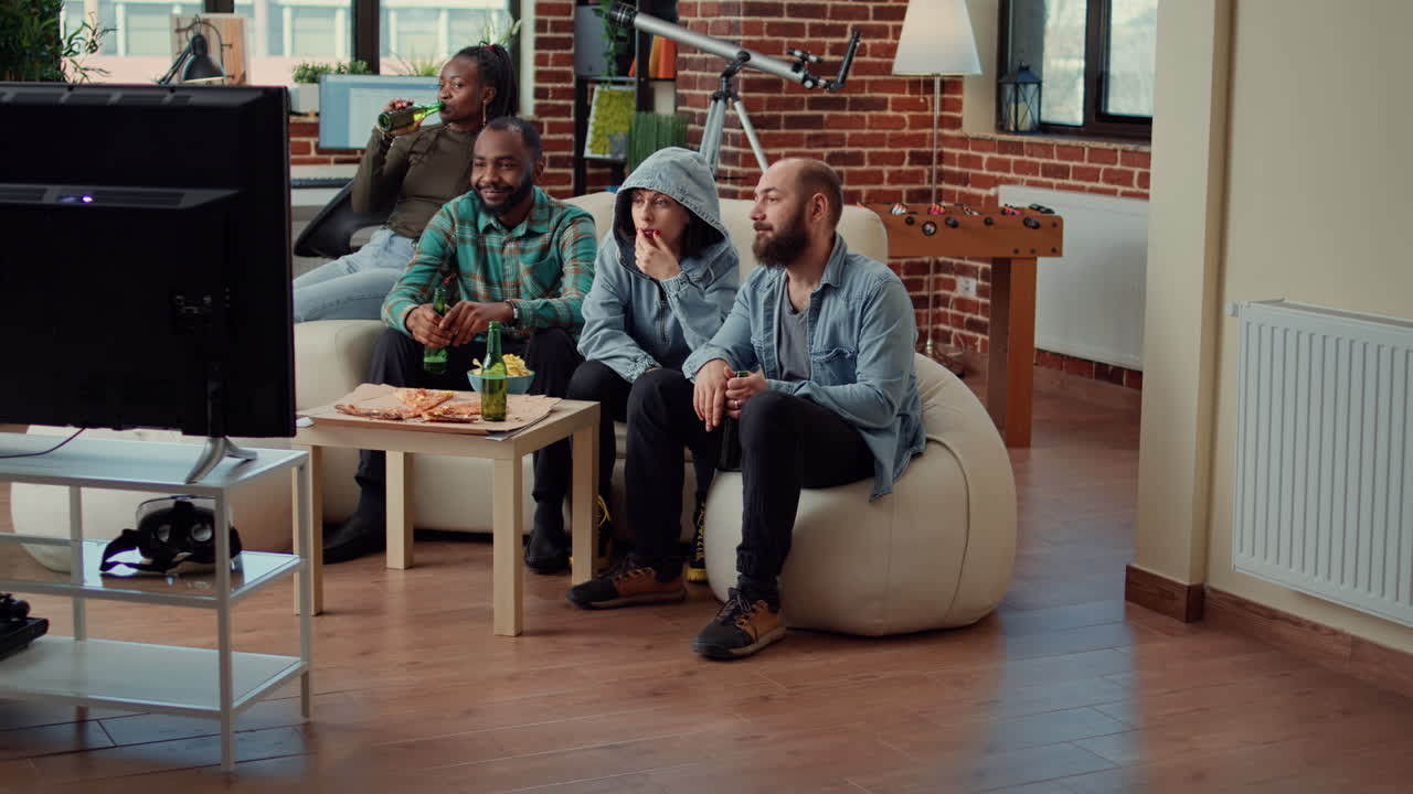 Group of friends watching movie on television channel program