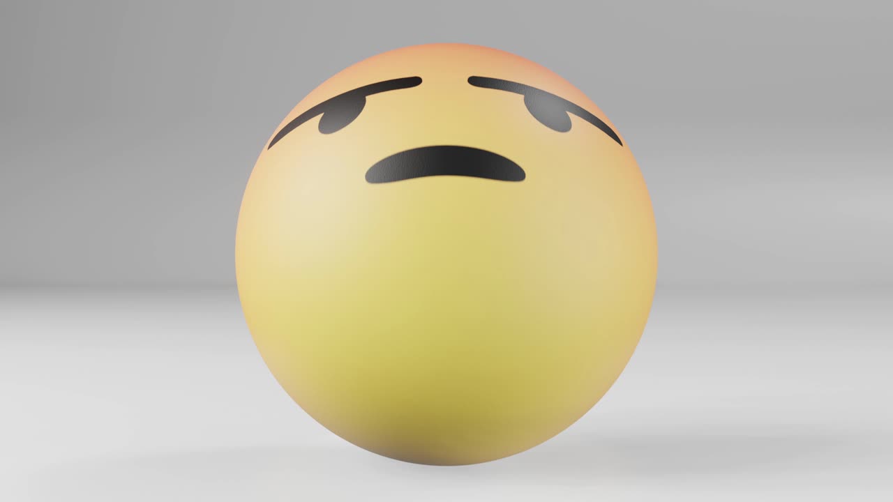 Angry reaction facebook button in the shape of giant rubber ball rolling