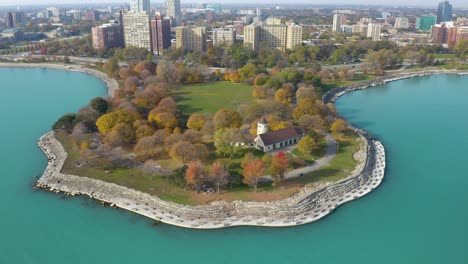 amazing aerial view of promontory point in chicago, descending shot in autumn