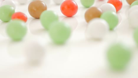 colorful background made of round candy bonbon on white 4k