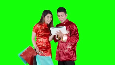 young asian couple shopping online with tablet