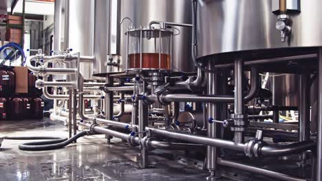 industrial stainless steel vats in modern brewery