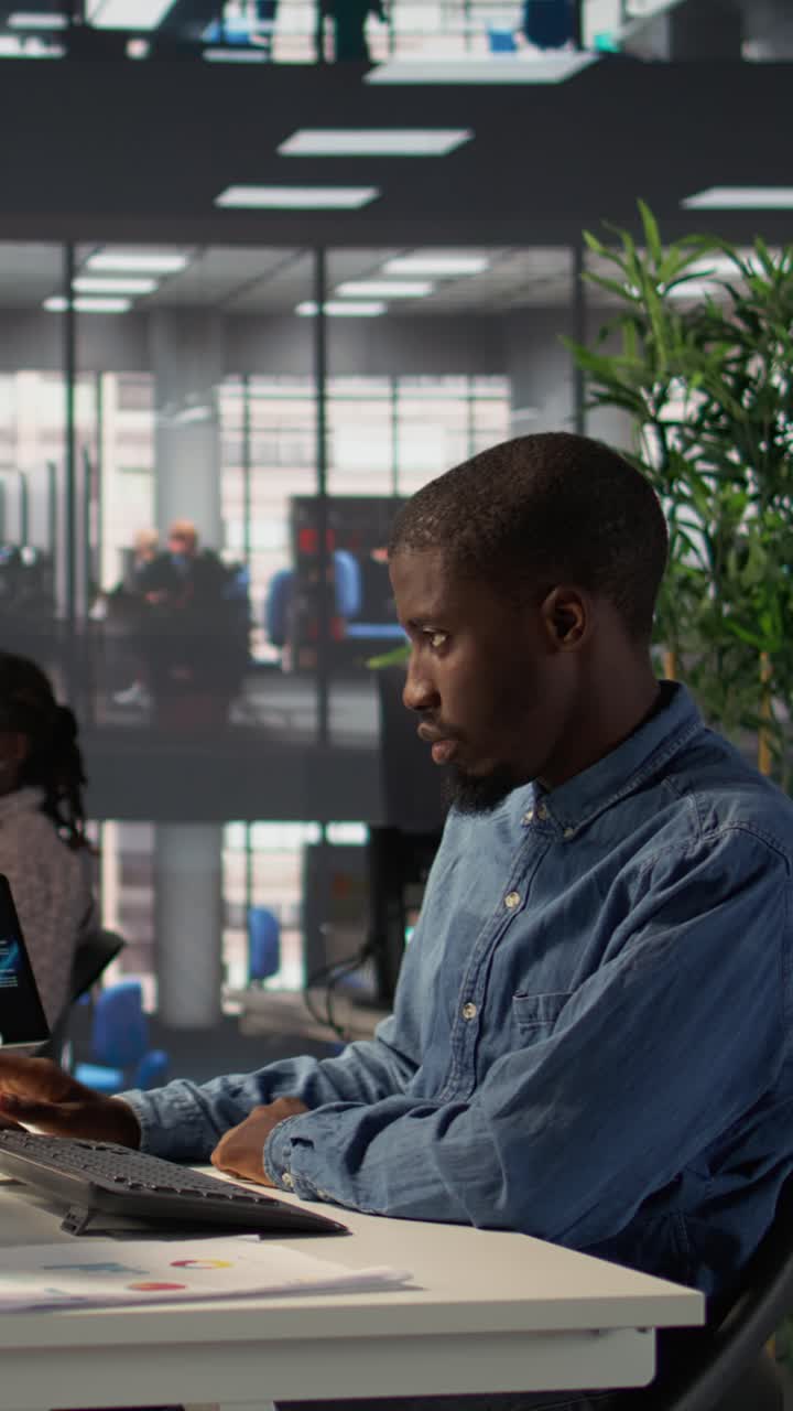 African American Man Working on Computer in Modern Office