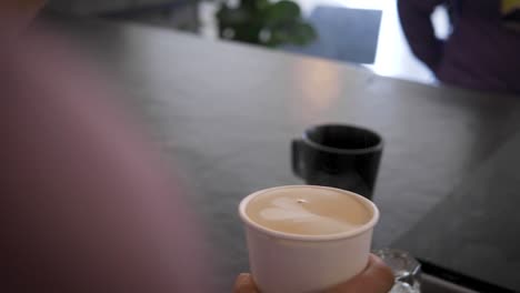 Latte-art-being-poured-at-coffee-shop