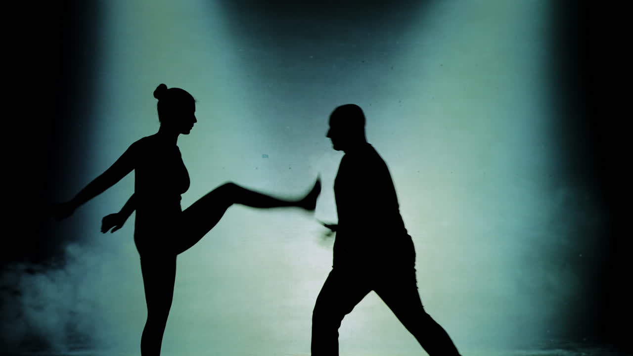 Silhouette Dancers Performing on Stage